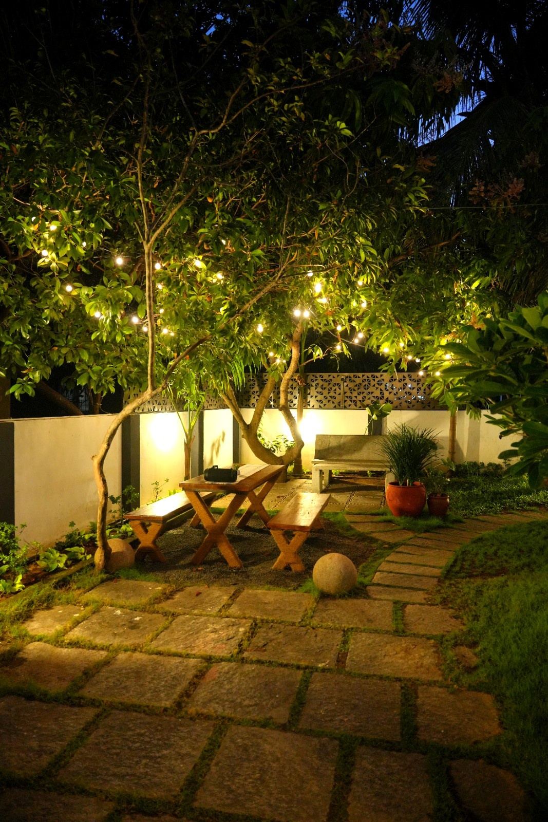 Outdoor dining table at night at The Bella Vista